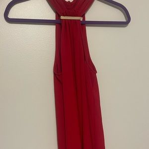 Red sleeveless MK top.
